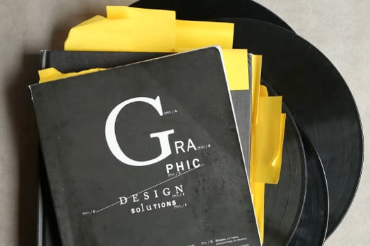 The cover of a black notebook labeled 'Graphic Design'